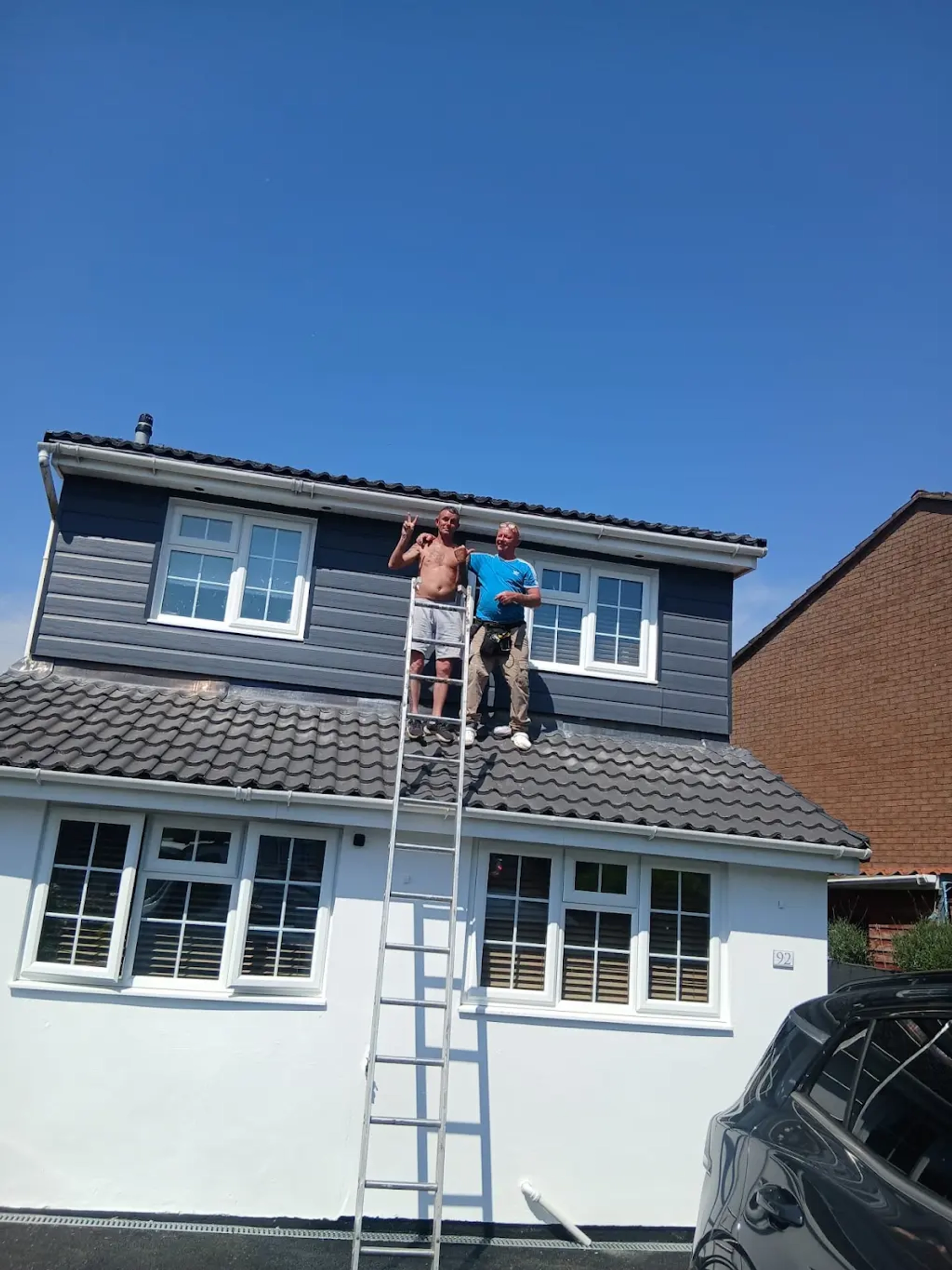 ALA Roofing & Building team working on a roof